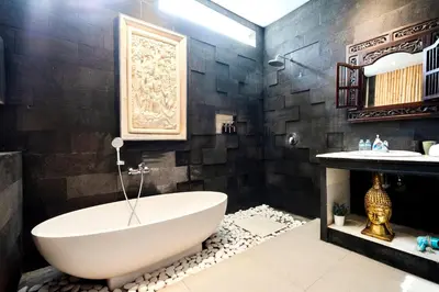 a bathroom with a large tub and a sink at 3BR Villa Carissa Seminyak Centre, Bali by Le Ciel Hospitality in Seminyak