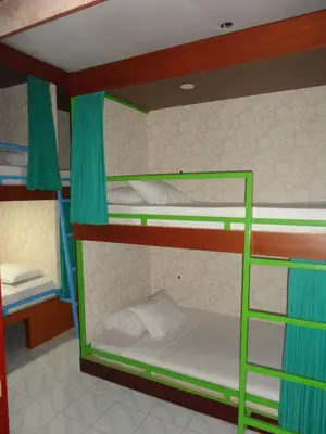 a bunk bed room with two bunk beds at Meriki Apartment in Seminyak