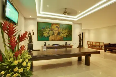 a large room with a large painting on the wall at KoenoKoeni Villa in Seminyak