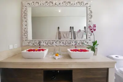 a bathroom with two white sinks and a mirror at Villa Koala, 2Br Close to W, Potato Head and Shi Shi in Seminyak