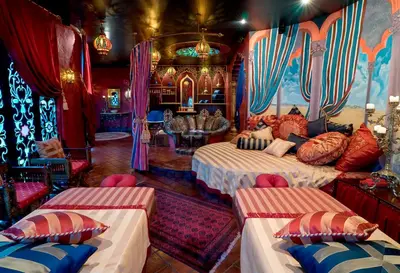 a room with two beds with pillows on it at Impiana Private Villas Seminyak in Seminyak