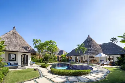 an exterior view of a villa with a swimming pool at Impiana Private Villas Seminyak in Seminyak