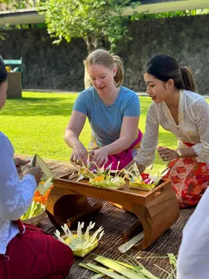 a group of women sitting around a picnic table at Impiana Private Villas Seminyak in Seminyak