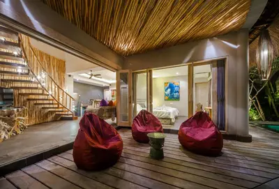 three red bean bags sitting on the floor of a room at Luxury Villas Merci Resort 3BR Seminyak #1 in Seminyak