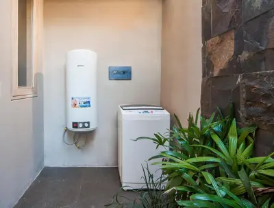 a heat pump sitting on the side of a wall at Luxury Villas Merci Resort 3BR Seminyak #1 in Seminyak