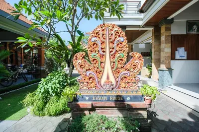 a large orange bench in front of a building at Wayan House Seminyak in Seminyak