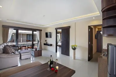 a living room with a couch and a table at d'Penjor Seminyak in Seminyak