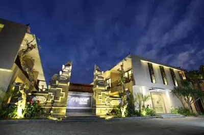 a building with lights on it at night at d'Penjor Seminyak in Seminyak