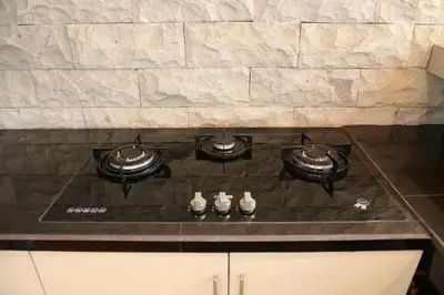 a stove top with pots and pans on it at Villa Latour in Seminyak