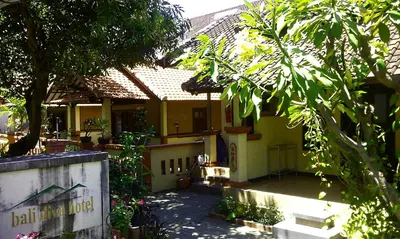 a building with a sign in front of it at Bali Diva Hotel Kuta in Kuta