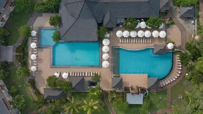 an overhead view of two swimming pools in a house at The Jayakarta Bali Beach Resort in Legian