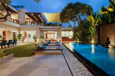 a pool in the backyard of a house at Villa Camellia by Nakula in Jimbaran