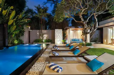 a pool in the backyard of a house at Villa Camellia by Nakula in Jimbaran