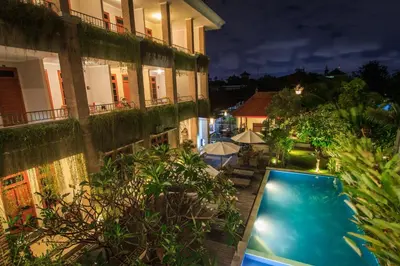 a view of a building with a swimming pool at Pondok Anyar Hotel in Kuta