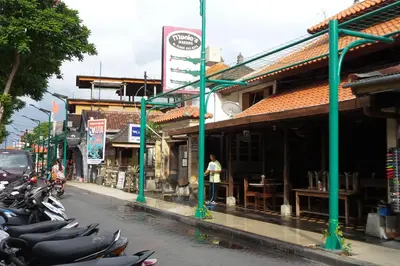 a row of motorcycles parked on the side of a street at Pondok Anyar Hotel in Kuta
