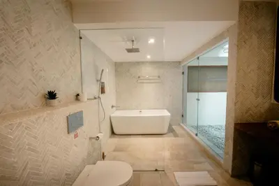 a bathroom with a bath tub and a toilet at Luxury Villa Seminyak near beach and Potato Head in Seminyak