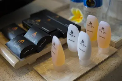 a group of bottles of soap on a counter at Sandi Agung Villa in Seminyak