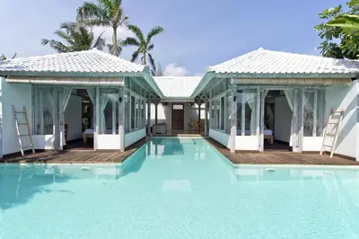 a swimming pool in front of a villa at Villa Laksmana Hideaway 2 - Surrounded by water- 2bd villa with fantastic pool! in Seminyak