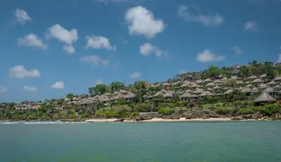 a resort on an island in the water at Four Seasons Resort Bali at Jimbaran Bay in Jimbaran
