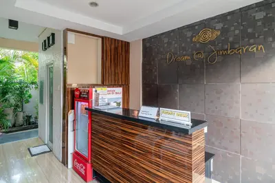 a restaurant with a counter and a refrigerator at Dream @ Jimbaran in Jimbaran