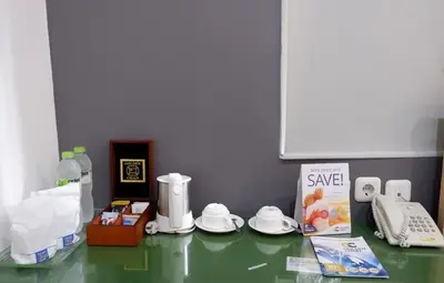 a counter top with some items on top of it at Ara Inn Bed And Breakfast by ecommerceloka in Kuta