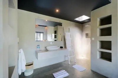 a bathroom with a sink and a mirror at Villa Suku Berawa in Canggu