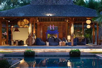 a house with a pool in front of it at Blue Karma Village in Seminyak