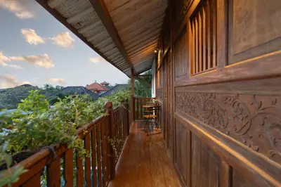 a balcony of a house with a view of the mountains at House of Bagera by Alfred in Bali in Seminyak