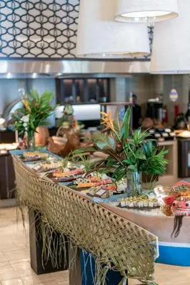 a buffet line with many different types of food at Conrad Bali in Nusa Dua