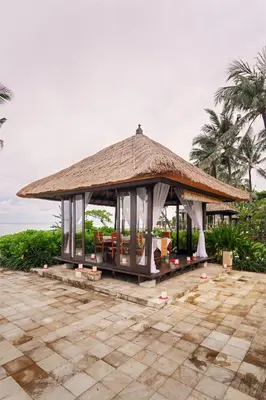 a gazebo with a thatched roof at Conrad Bali in Nusa Dua