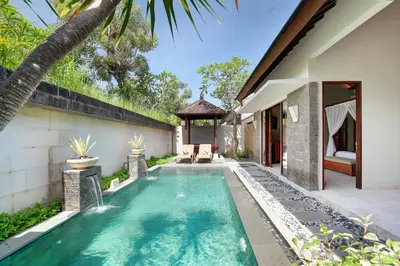 an infinity pool in the backyard of a villa at Lumbini Luxury Villas and Spa in Jimbaran