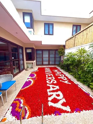 a carpet of flowers in front of a building at Beautiful Bali Villas - 6 mins walk to the beach in Legian