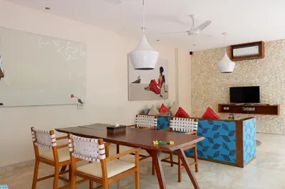 a dining room with a wooden table and chairs at Beautiful Bali Villas - 6 mins walk to the beach in Legian
