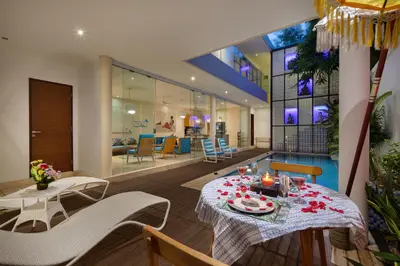 a dining room with a table and chairs at Beautiful Bali Villas - 6 mins walk to the beach in Legian