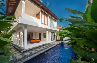 an external view of a villa with a swimming pool at Villa Pearl Seminyak in Seminyak