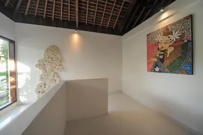 a white room with a painting on the wall at Villa Pearl Seminyak in Seminyak