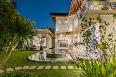 a house with a fountain in the yard at Luxury - Villa K - Central Seminyak in Seminyak