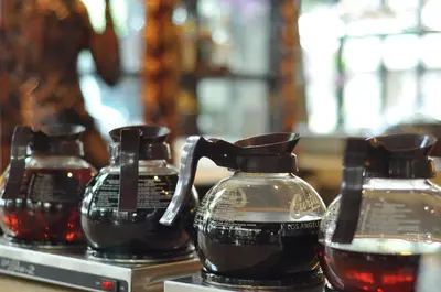 a group of three glass vases sitting on a table at Hotel Kumala Pantai in Legian