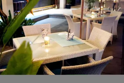 a table with butterflies sitting on top of it at Kaniya bali in Nusa Dua