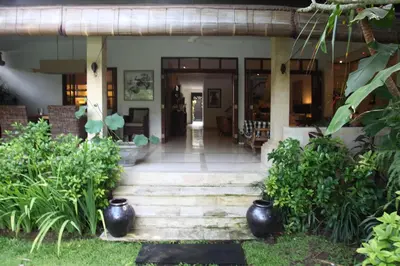 a house with a staircase leading to the front door at Villa Casa Bali - your home away from home in Seminyak