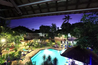 an overhead view of a swimming pool at night at Bali Sandy Resort in Kuta