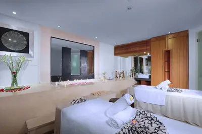 a hotel room with two beds and a sink at Lv8 Resort Hotel in Canggu