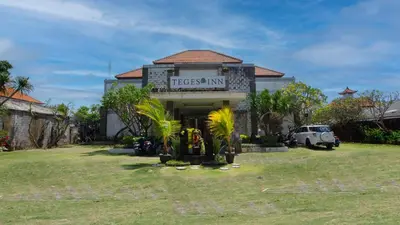 a building with a sign that reads tiger inn at Teges Inn Kuta in Kuta