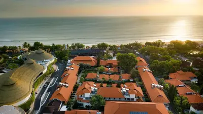 an aerial view of a town with houses and the ocean at Grand Istana Rama Hotel in Kuta