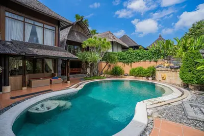 an image of a swimming pool in front of a house at Nipper Villa - Spacious 4BR in Canggu in Canggu