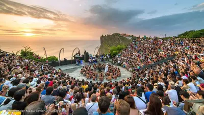 a large crowd of people watching a concert on a stage at Bali Bobo Hostel in Jimbaran