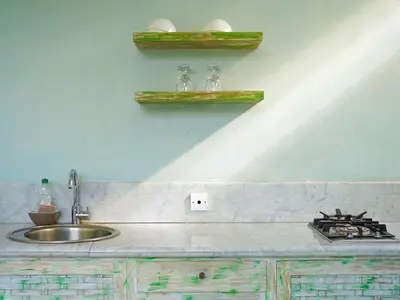 a kitchen with a sink and a counter top at New Pondok Sara Villas in Seminyak