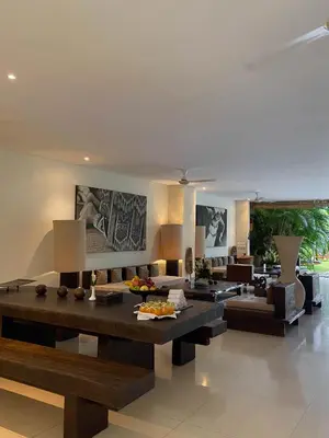 a living room with a couch and a table at Villa Chocolat Seminyak in Seminyak