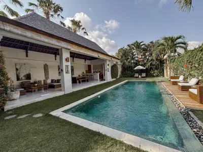 a swimming pool in the backyard of a house at Villa Chocolat Seminyak in Seminyak