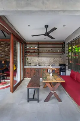 a living room with a couch and a table at Vinna Villa Seminyak by The Wina Resorts in Kerobokan